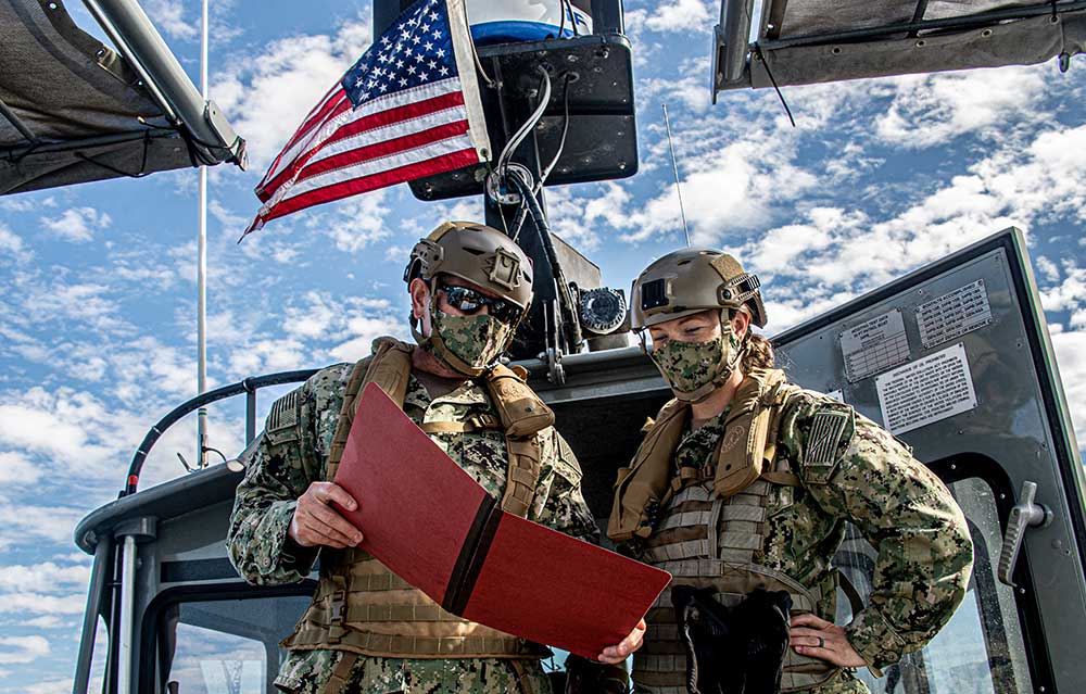 Maritime Expeditionary Security Squadron Sailors plan maritime patrol operations.