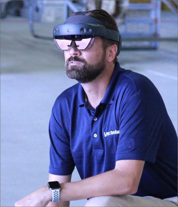 Developer testing a mixed-reality headset for use in training and operations